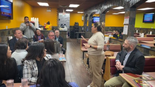 Senator Celina Villanueva talking to IL Corn board and other members of IL Latino Caucus
